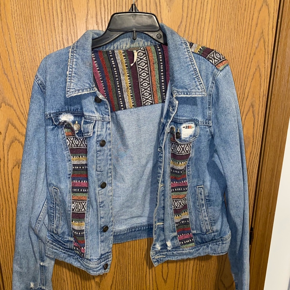 Free People light wash denim jacket! Distressed detailing and colorful patchwork